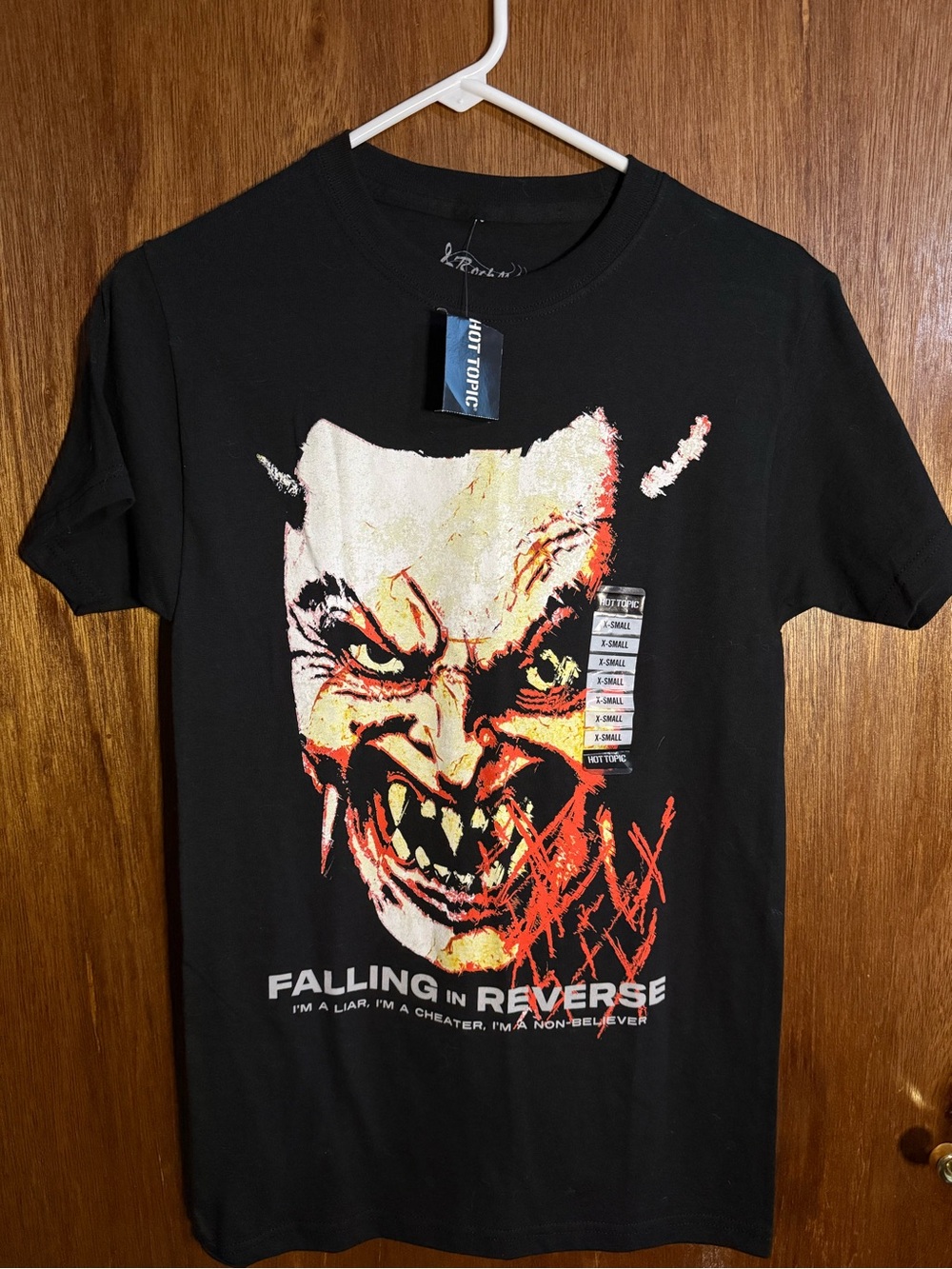 Hot Topic Black Falling In Reverse Demon Graphic Tee with Red and Cream Accents